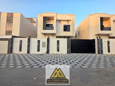 Al Zahya, Ajman, brand new and first occupancy, featuring a unique modern design and high-end finishing. The villa is located in a prime area directly