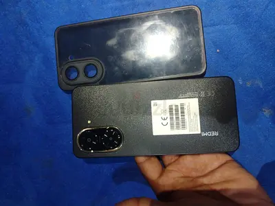 Used Redmi smartphone with case - good working condition