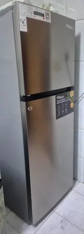 My two-door stainless steel refrigerator - good condition with warranty.