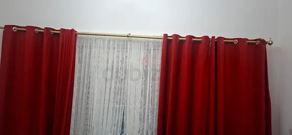 Pair of Red Eyelet Curtains with White Lace Sheer and Home Centre curtain Rod
