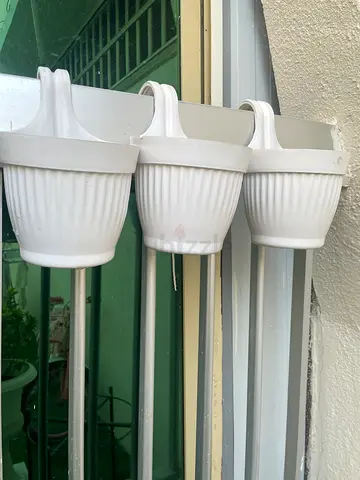 Balcony rail hanging white plant pot