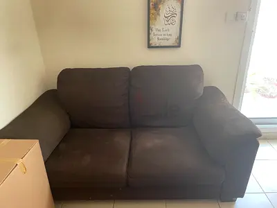 Two-seater brown fabric sofa — good condition, comfortable