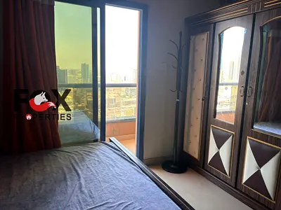 Annual rent in Al Nuaimiya C Towers\,Parking together\ elegant furnished studio, very spacious layout, open view with balcony, high floor.