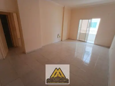 1-bedroom apartment with living room in Al Rashidiya 3, Ajman, balcony, 2 bathrooms, master bedroom, central AC, free maintenance, AED 28,000 in 4 ins