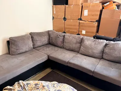 L-shaped grey fabric corner sofa