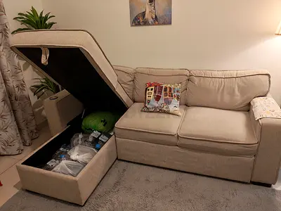 Beige fabric 3-seater storage sofa with pull-out bed option