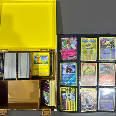 Large Collection of Pokémon Trading Cards with Binder and Storage Box