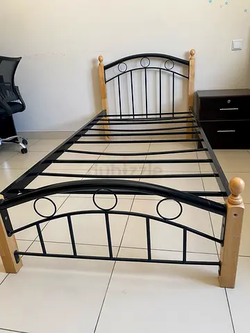 Single metal bed frame with wooden posts - good condition