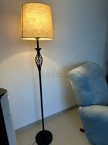 Tall black metal floor lamp with woven drum shade — good condition