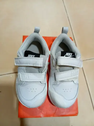 White Nike kids sneakers with velcro straps - size not stated