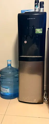 Used water dispenser with 5-gallon bottle included