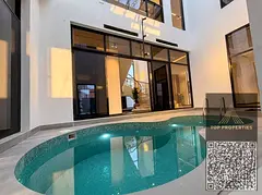 For sale, a corner villa with an indoor pool, elegant finishing and a modern design, two floors and