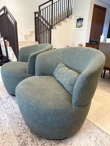 Pair of Comfortable Modern Curved Lounge Chairs - Light Grey green fabric. Price AED700 each chair