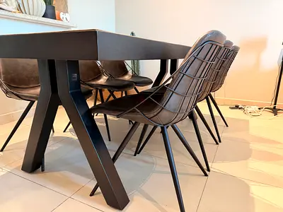 Modern black dining table with 6 matching metal-frame chairs