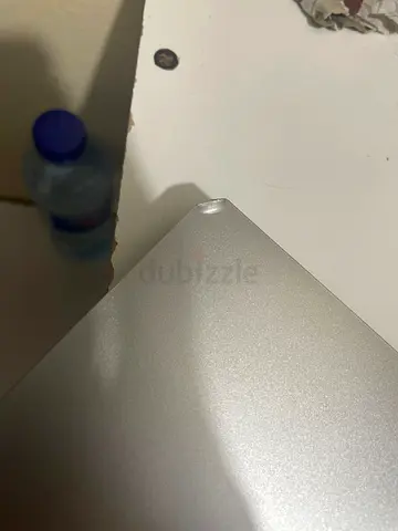 Silver laptop (minor dent on corner) - reasonable condition
