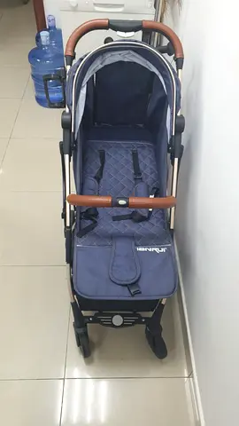 Lightly used navy blue stroller with leatherette handles — good condition