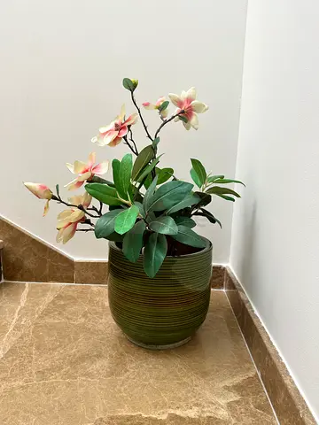 Artificial plant with green pot planter