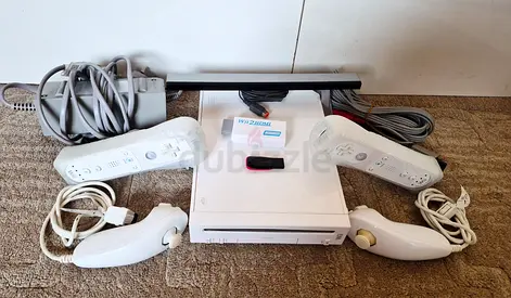 Nintendo Wii with all cables, 2 controllers and more than 50 games