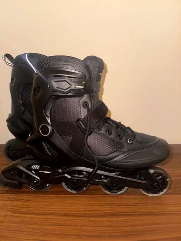 Black inline rollerblades, size not specified — good condition.