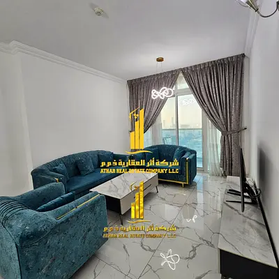With a sea view. Luxurious two-bedroom apartment with a living room and balcony, brand new, never before occupied. Ajman, Oasis Tower.
