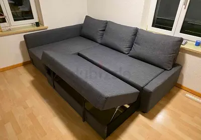 Gray L-shaped Sofa Bed with Storage — Good Condition