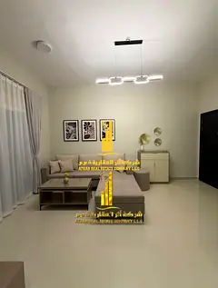 Near Ajman University, a luxurious and elegant fully furnished room and living room with brand new V