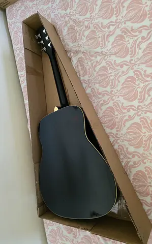 Used black acoustic-electric guitar in good condition