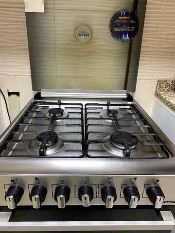Used 4-Burner Stainless Steel Gas Cooker with Oven - Good Condition
