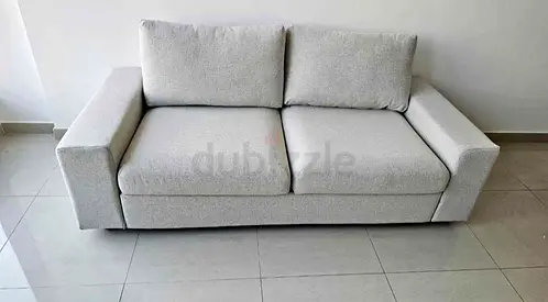 Light grey 2-seater sofa in good condition