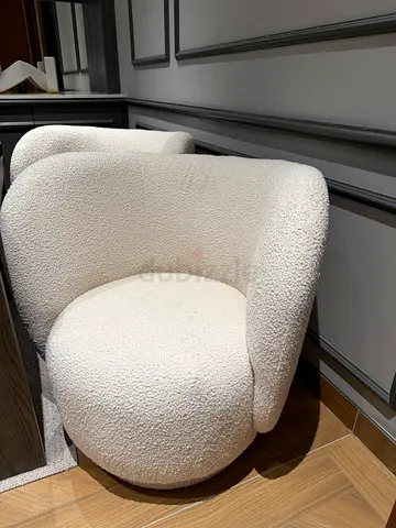 To sell bouclé cream swivel chair set