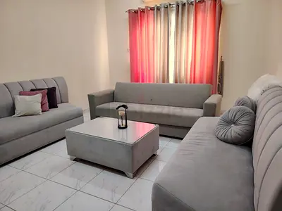 Light grey 3-piece sofa set with matching ottoman - good condition