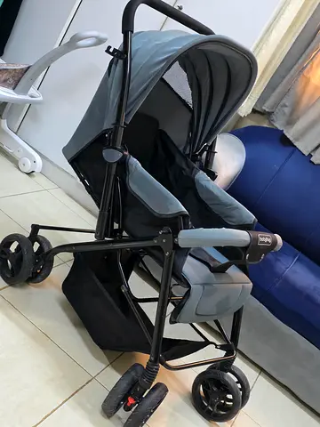 Light grey standard baby stroller in good condition