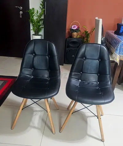 Pair of Black Tufted Chairs with Wooden Legs