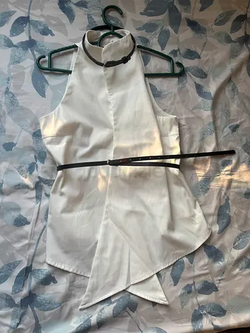 White Sleeveless High Neck Blouse with Thin Black Belt