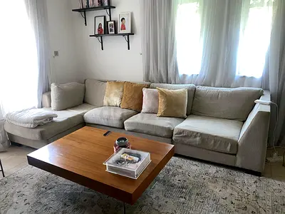 Light beige L-shaped fabric sofa with chaise, good condition