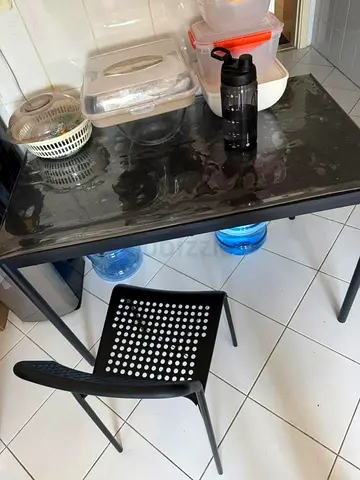 Compact black dining table with matching 4 chair s- good condition