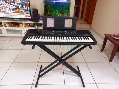 Portable electronic keyboard with X-stand and music rest - good condition