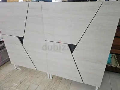 Modern light-wood sideboard / cabinet with geometric panel doors