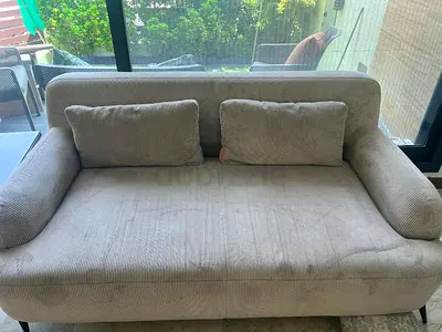 Three and two-seater and 1 seat beige sofa in good condition