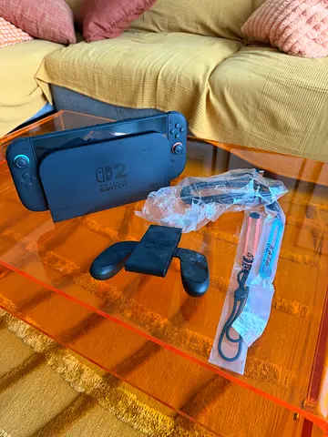Nintendo Switch 2 console with Joy-Con grip and straps - used