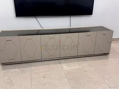 Modern TV Console with Geometric Pattern and Gold Accents