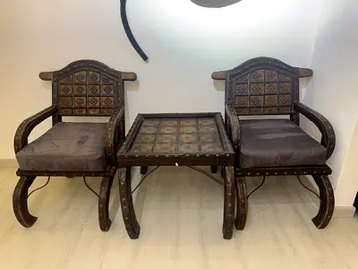 Vintage style pair of arm chairs with matching side table.