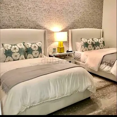 Pair of upholstered single beds with headboards — good condition