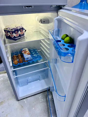 Compact double-door fridge in good working condition
