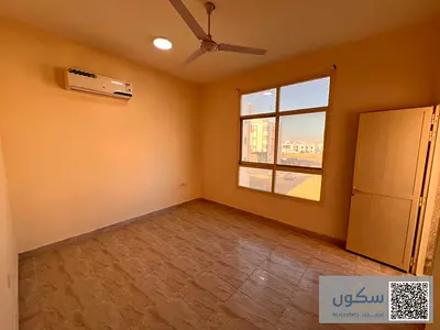 غرفة وصالة مساحة واسعة مع بلكونة وحمامين على شارع محمد بن زايد