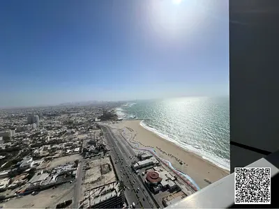 Distress Deal: Vacant 1BHK in Corniche Tower Ajman | 2 Baths, 1336 Sq Ft | Partial Sea View | Cash Only