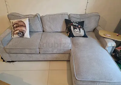 Light grey L-shaped fabric sofa with chaise (3-seater), with pull out bed and storage