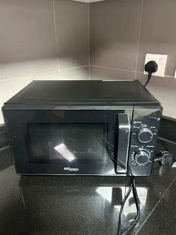 Super General Black Microwave Oven with Manual Dials