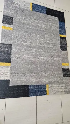 Light grey modern area rug with blue and yellow accents - good condition- 120x160