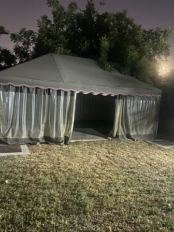 Large outdoor gazebo/canopy with mesh curtains — good condition